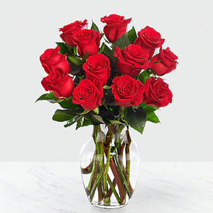 Dozen Red Roses in a Vase with Greens