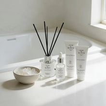 Load image into Gallery viewer, Skincare products on a bathroom counter with natural light