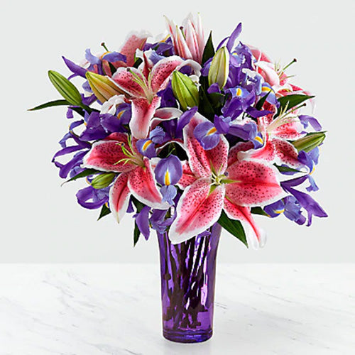 Purple Irises & Pink Lilies in a Purple Glass Vase