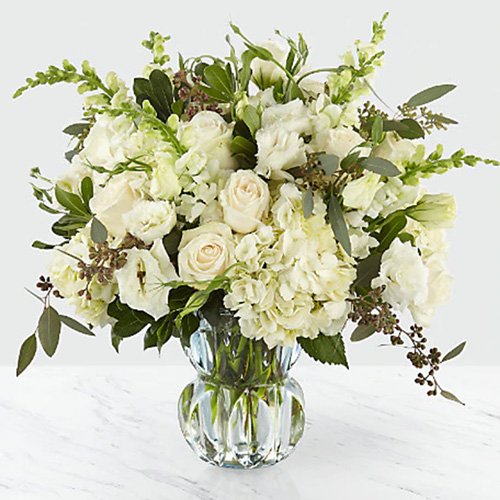 All White Assorted Flowers with Greens in a Vase